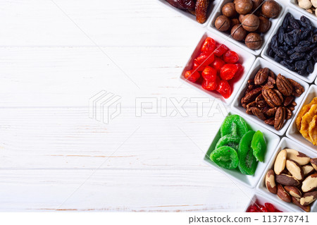 Mix of dried and candied fruits and nuts 113778741