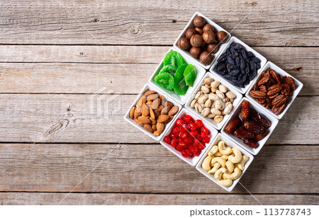 Mix of dried and candied fruits and nuts Mix of dried and candied fruits and nuts 113778743