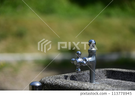 Drinking fountain tap in the park Drinking fountain tap in the park 113778945