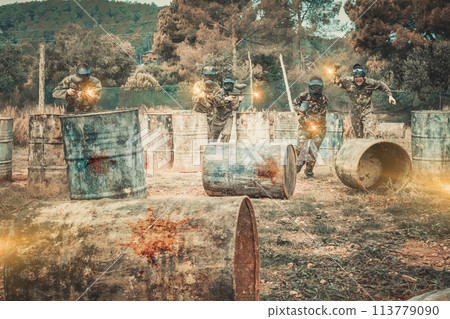 Group of people playing paintball 113779090