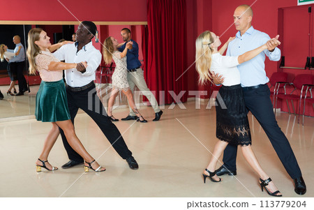 Couples enjoying foxtrot Couples enjoying foxtrot 113779204