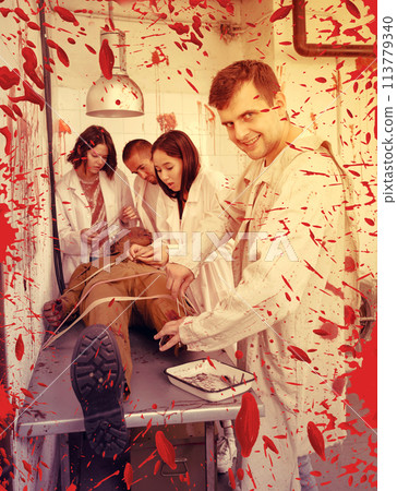 Guy with mad look over zombie mannequin Guy with mad look over zombie mannequin 113779340