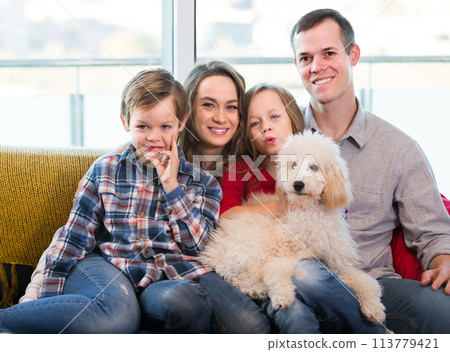 young parents and children happy to spend time at home 113779421