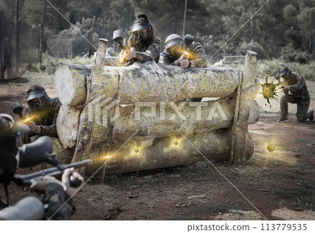 daring teams facing on battlefield in outdoor paintball arena 113779535