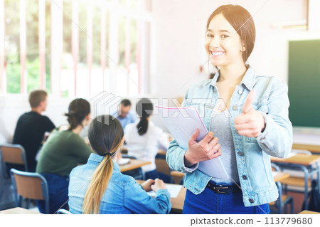 smiling schoolgirl who is satisfied assessment smiling schoolgirl who is satisfied assessment 113779680