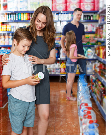 Mother and son choosing meal Mother and son choosing meal 113780153
