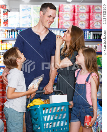 Parents with girl and boy with cart Parents with girl and boy with cart 113780199