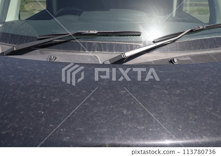 A car hood dirty with yellow sand A car hood dirty with yellow sand 113780736