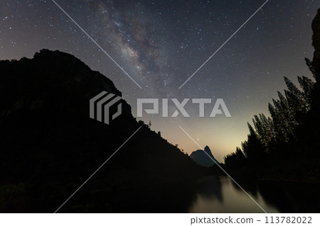 Milky Way towers over a large pond in the mine 113782022