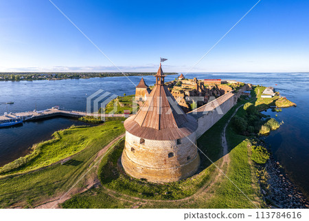 Europe. Russia, Leningrad region, St. Petersburg, Aerial panoramic view on fortress Oreshek near Schlesselburg town. Ancient Russian fort on island in Ladoga lake in sunny summery day Europe. Russia, Leningrad region, St. Petersburg, Aerial panoramic view on fortress Oreshek near Schlesselburg town. Ancient Russian fort on island in Ladoga lake in sunny summery day 113784616