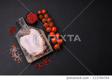 Fresh raw chicken thighs with salt and spices Fresh raw chicken thighs with salt and spices 113784764