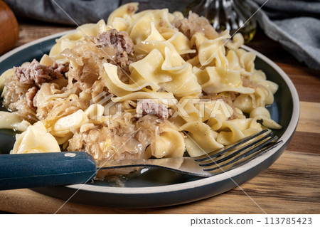 Pasta with sauerkraut and meat. 113785423