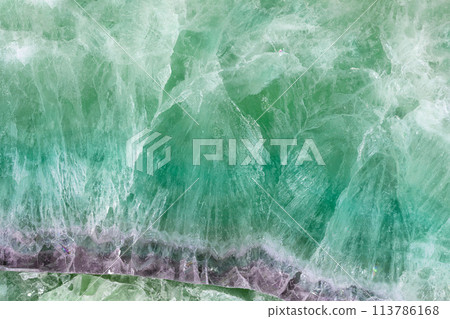 Green Fluorite. Gemstone background. Matt natural semi precious mineral pattern. Green Fluorite. Gemstone background. Matt natural semi precious mineral pattern. 113786168