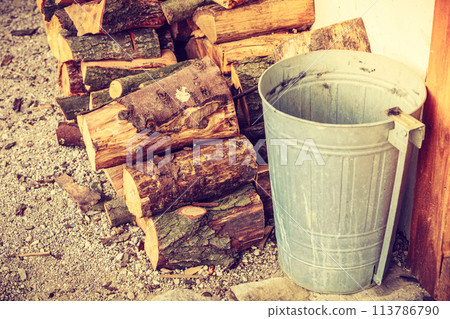 Firewood, pile of wood standing outside Firewood, pile of wood standing outside 113786790