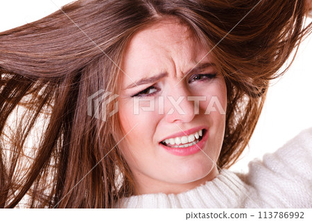 Woman pulls hair being sad. Woman pulls hair being sad. 113786992
