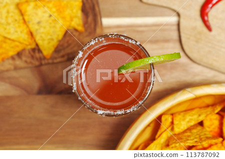 Michelada, Mexican alcoholic cocktail with beer, lime juice, tomato juice Michelada, Mexican alcoholic cocktail with beer, lime juice, tomato juice 113787092