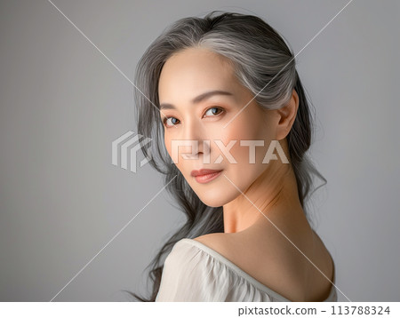 Asian woman with graceful silver hair Asian woman with graceful silver hair 113788324
