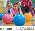 Physical education class in a school gym, kids playing dodgeball, teacher supervising, educational and fun 113788688