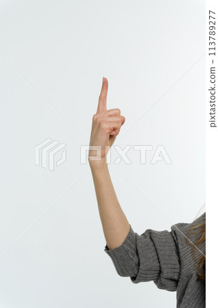 Female hand pointing up with finger number one 113789277