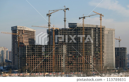 Kiev, Ukraine January 19, 2021: Tower construction cranes on the construction of high-rise buildings 113789831