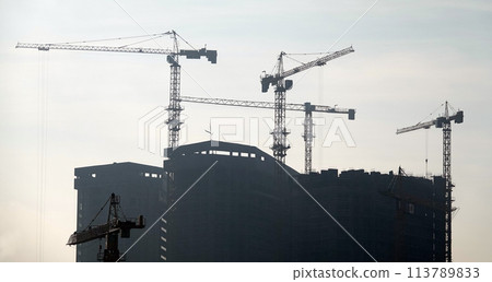 Kiev, Ukraine January 21, 2021: Tower construction cranes on the construction of high-rise buildings 113789833