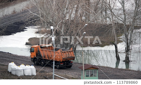 Kiev, Ukraine March 13, 2019: Tractors and excavators work on the construction of the foundation zero cycle Kiev, Ukraine March 13, 2019: Tractors and excavators work on the construction of the foundation zero cycle 113789860