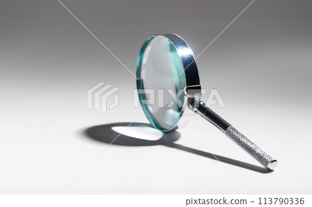Magnify mystery with silver lens. Study, inspect, search. Abstract concept of scientific 113790336