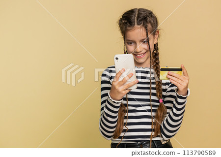 Child girl use credit bank card smartphone while transferring spend money purchases online shopping 113790589
