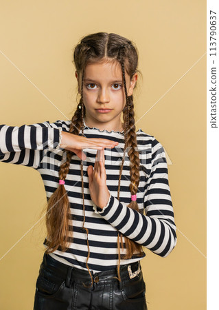 Tired upset child girl kid showing pause gesture limit or stop sign time out take a break relax rest Tired upset child girl kid showing pause gesture limit or stop sign time out take a break relax rest 113790637