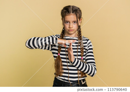 Tired upset child girl kid showing pause gesture limit or stop sign time out take a break relax rest Tired upset child girl kid showing pause gesture limit or stop sign time out take a break relax rest 113790640