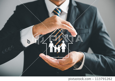 Businessman protective gesture symbolizes holistic insurance protection for family, life, health, and house. Icons distinctly emphasize family life insurance and policy concepts. 113791262