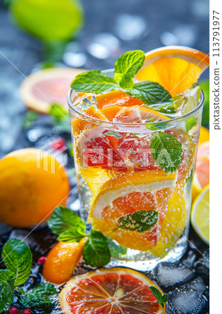 refreshing summer cocktail with orange and mint 113791977