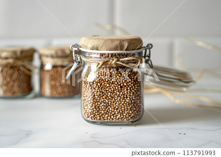 Buckwheat stored in a glass jar 113791993