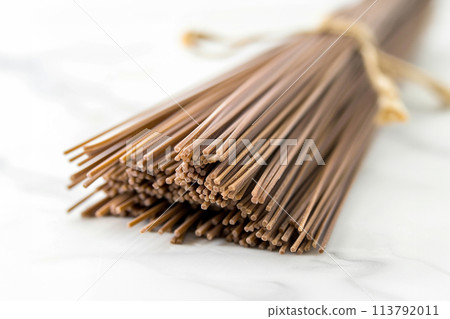 Buckwheat noodles closeup. Raw food ingredient. Dried buckwheat soba noodles. Traditional Japanese food 113792011