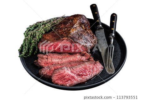 Grilled hanger or Onglet beef meat steak on a plate with thyme. Isolated on white background. Top view. Grilled hanger or Onglet beef meat steak on a plate with thyme. Isolated on white background. Top view. 113793551