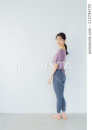 Woman practicing yoga in a yoga studio 113794770