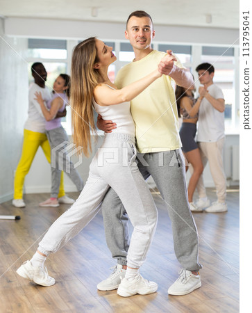 Young man and woman dancing latin dances Young man and woman dancing latin dances 113795041