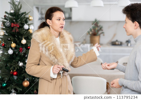 Mother leaving house, son staying home Mother leaving house, son staying home 113795234