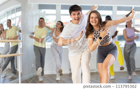 Couple young woman and man dancing twist 113795302