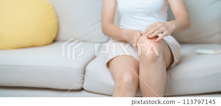 Arthritis and Muscle Pain Relief Cream concept. woman having knee ache and muscle pain due to Runners Knee or Patellofemoral Pain Syndrome, osteoarthritis, rheumatism and Patellar Tendinitis 113797145