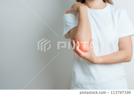 Woman having elbow ache at home, muscle pain due to lateral epicondylitis or tennis elbow. injury, Health and medical concept Woman having elbow ache at home, muscle pain due to lateral epicondylitis or tennis elbow. injury, Health and medical concept 113797190