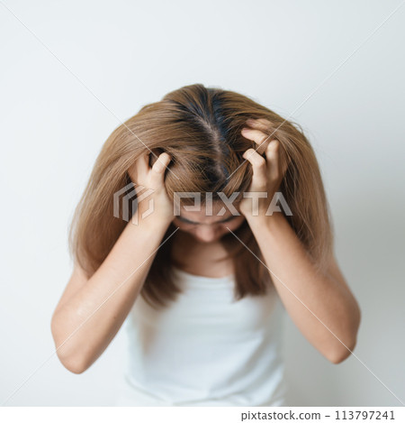 Stress, Sad and unhappy concepts. Alone asian Woman having headache, Young female feeling frustrated, exhausted and suffering 113797241