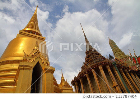 The golden pagoda and buildings of Wat Phra Kaew, also known as the Temple of the Emerald Buddha and Phra Ratchawan, in Bangkok, the capital of Thailand 113797404