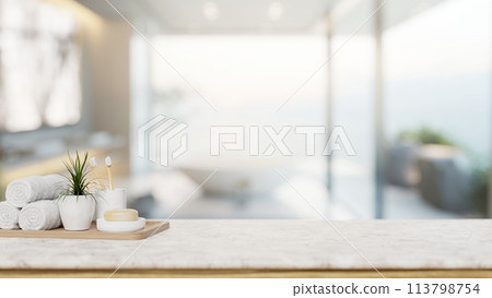 A toiletry set with an empty space for display products on a tabletop in a modern luxury bathroom. 113798754