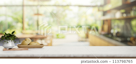 A luxury white marble kitchen tabletop in a contemporary spacious home kitchen. A luxury white marble kitchen tabletop in a contemporary spacious home kitchen. 113798765