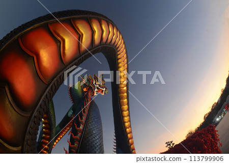 This Naga body is called Grandpa Phaya Sri Phet Khiri Mahamuni Srisutthonakarat Enshrined at Tham Chaeng Temple, it is a large and colorful Naga figure. 113799906