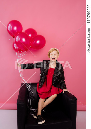 Child in red dress, leather jacket, balloons. Child in red dress, leather jacket, balloons. 113799995
