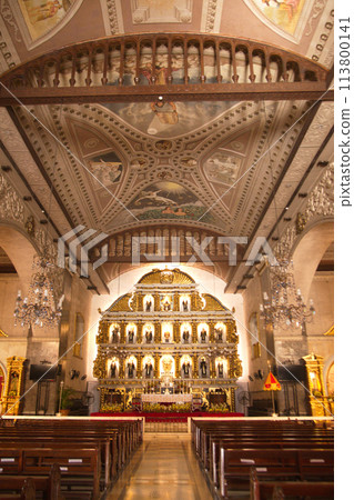 Jesus Christ Crucifixion on Cross and Saint Statues on altar at Basilica Minore del Santo Nino, the oldest church in the Philippines. Built in 1565 by Spanish colonists. 113800141