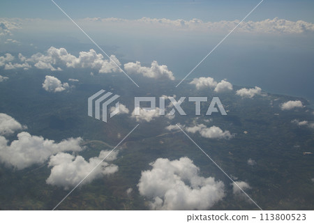 Nature background of sky view with clounds from above from airplane and see the land below. Nature background of sky view with clounds from above from airplane and see the land below. 113800523