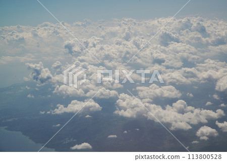 Nature background of sky view with clounds from above from airplane and see the land below. Nature background of sky view with clounds from above from airplane and see the land below. 113800528
